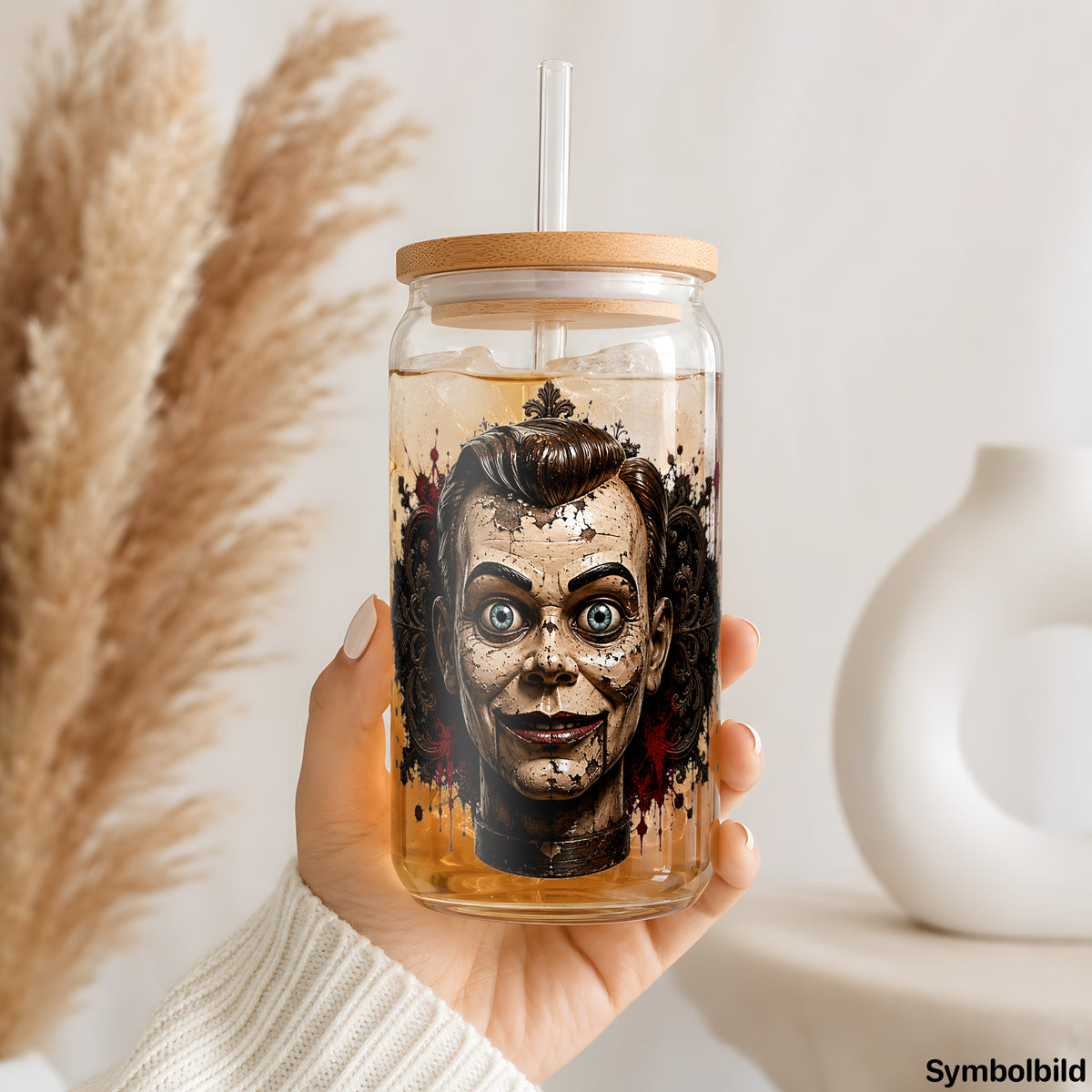 Becher-Aufkleber „Grinsende Puppe“ auf einem 16oz Glasbecher