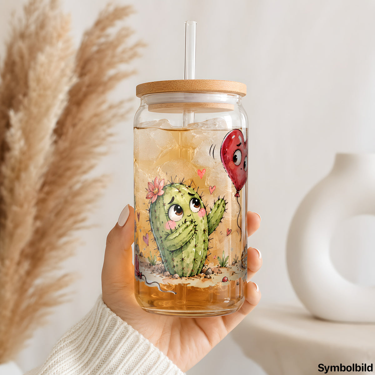 Becher-Aufkleber „Liebe kann weh tun“ auf einem 16oz Glasbecher